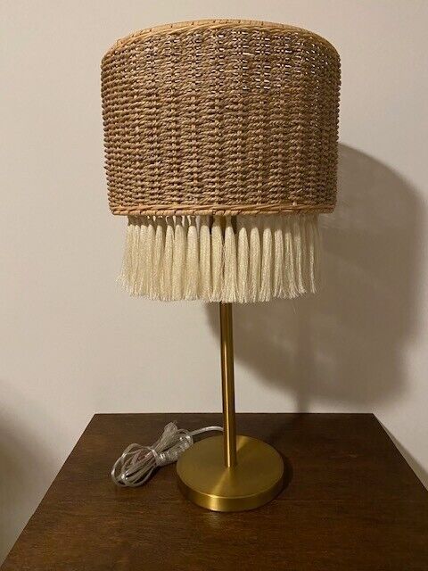 Brushed gold table lamp with natural tassel shade, 26 x 13 in